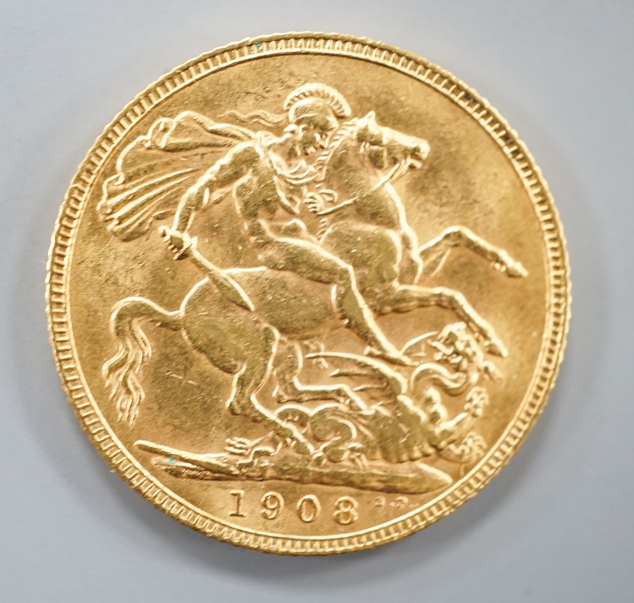 An Edward VII 1908 gold sovereign.